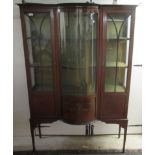 An Edwardian satinwood inlaid mahogany display cabinet with a central bow front panel, flanked by