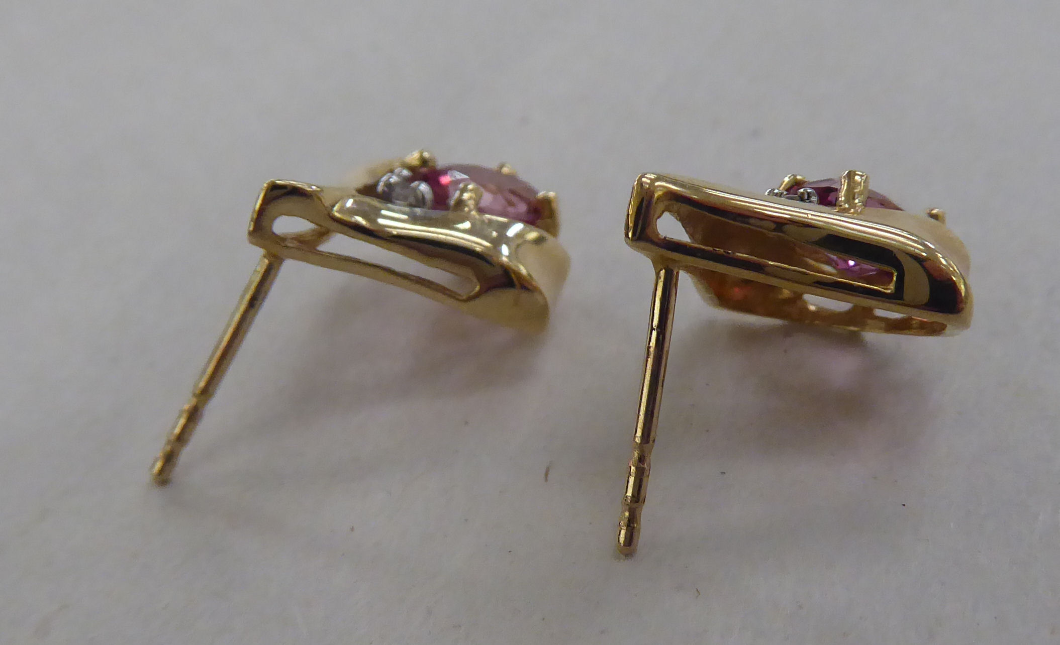 A pair of 10k gold earrings, each set with a pink stone and a diamond - Image 3 of 3