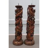 A pair of modern Asian carved softwood and gilded framed pricket candlesticks  18"h
