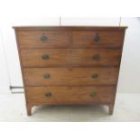 An early 19thC mahogany dressing chest with two short/three graduated long drawers, raised on