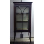 An Edwardian satinwood inlaid mahogany display cabinet with a single astragal glazed door, raised on