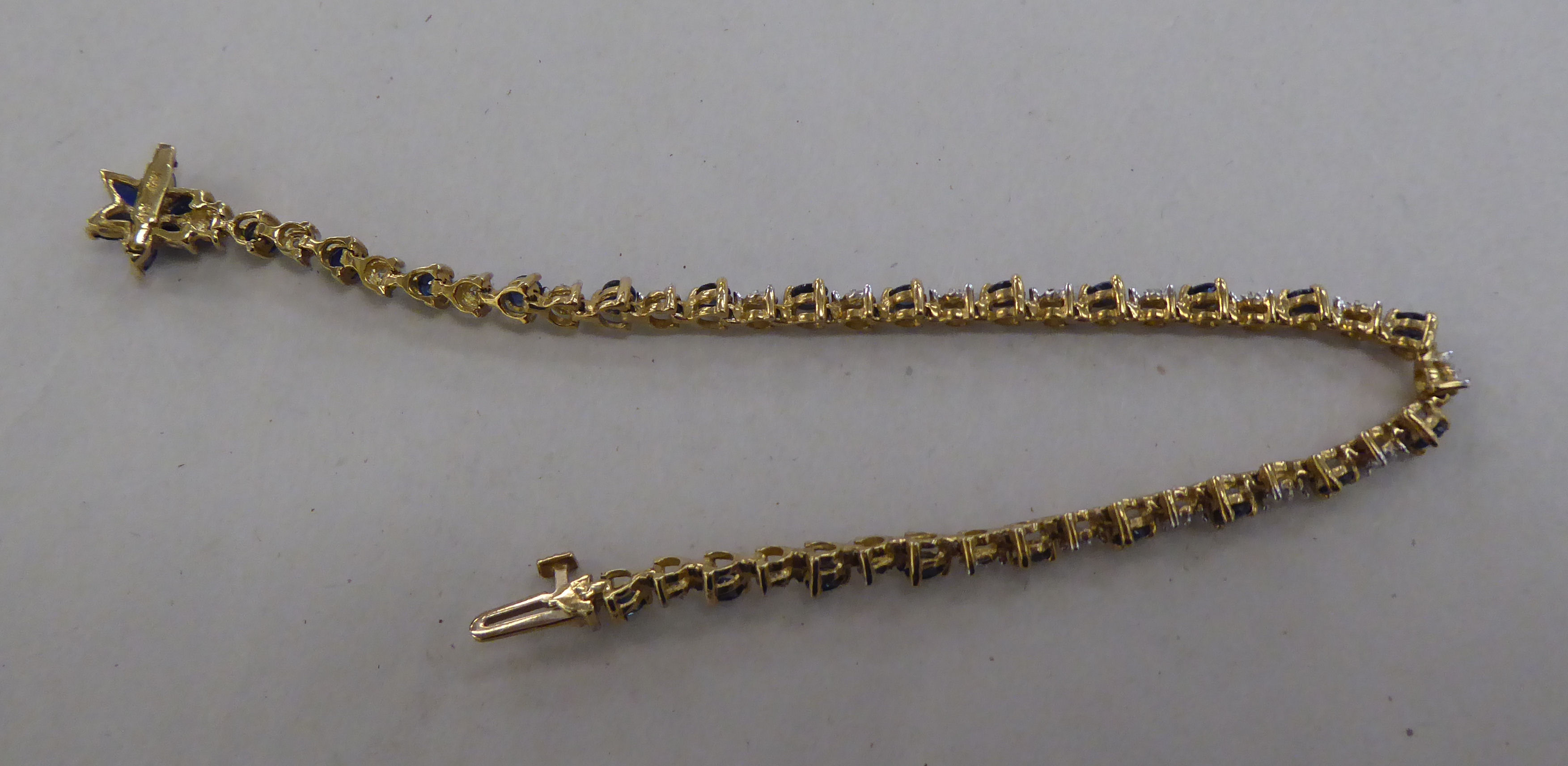 A 10k gold bracelet, set with sapphires and diamonds - Image 3 of 4