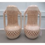 A pair of Bretby china twin handled vases of bulbous cylindrical form  11"h