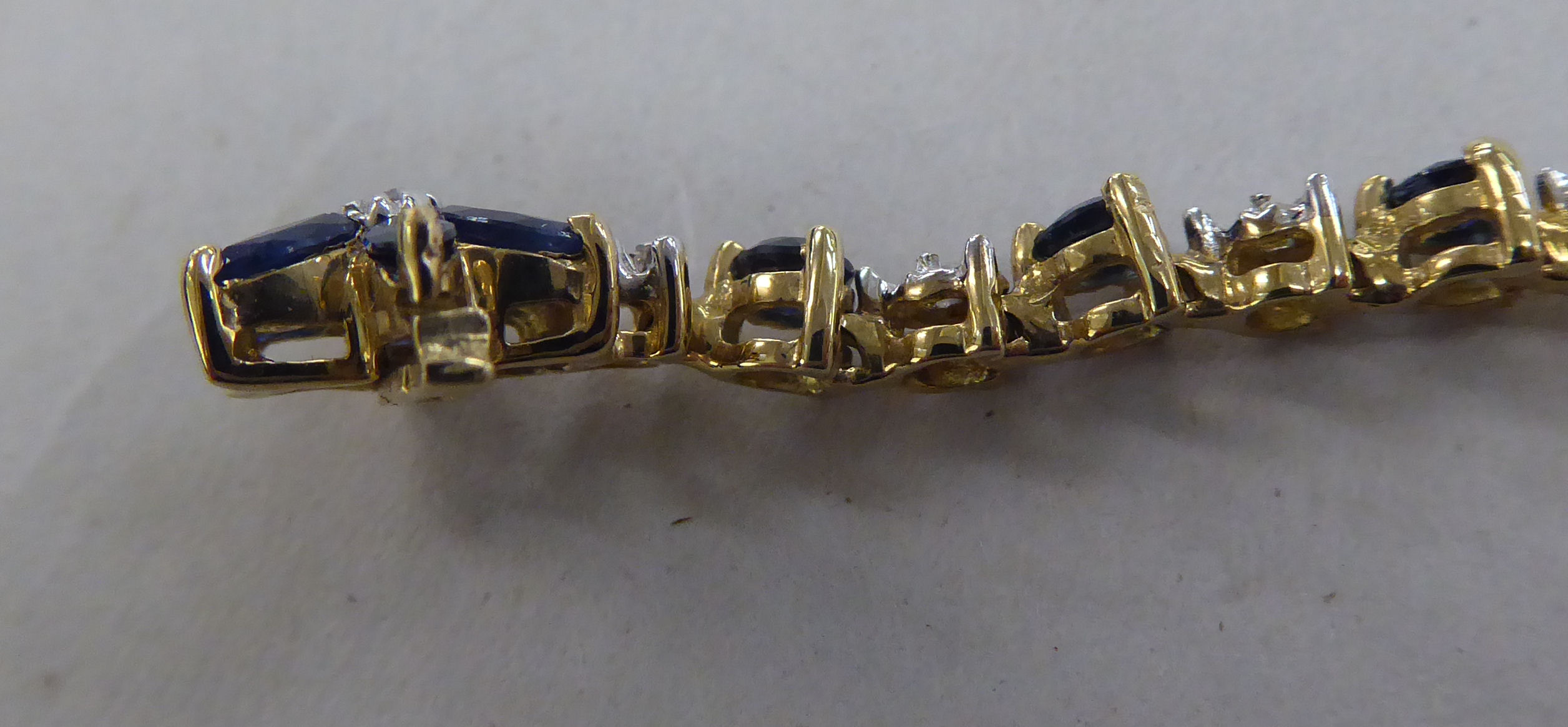 A 10k gold bracelet, set with sapphires and diamonds - Image 4 of 4