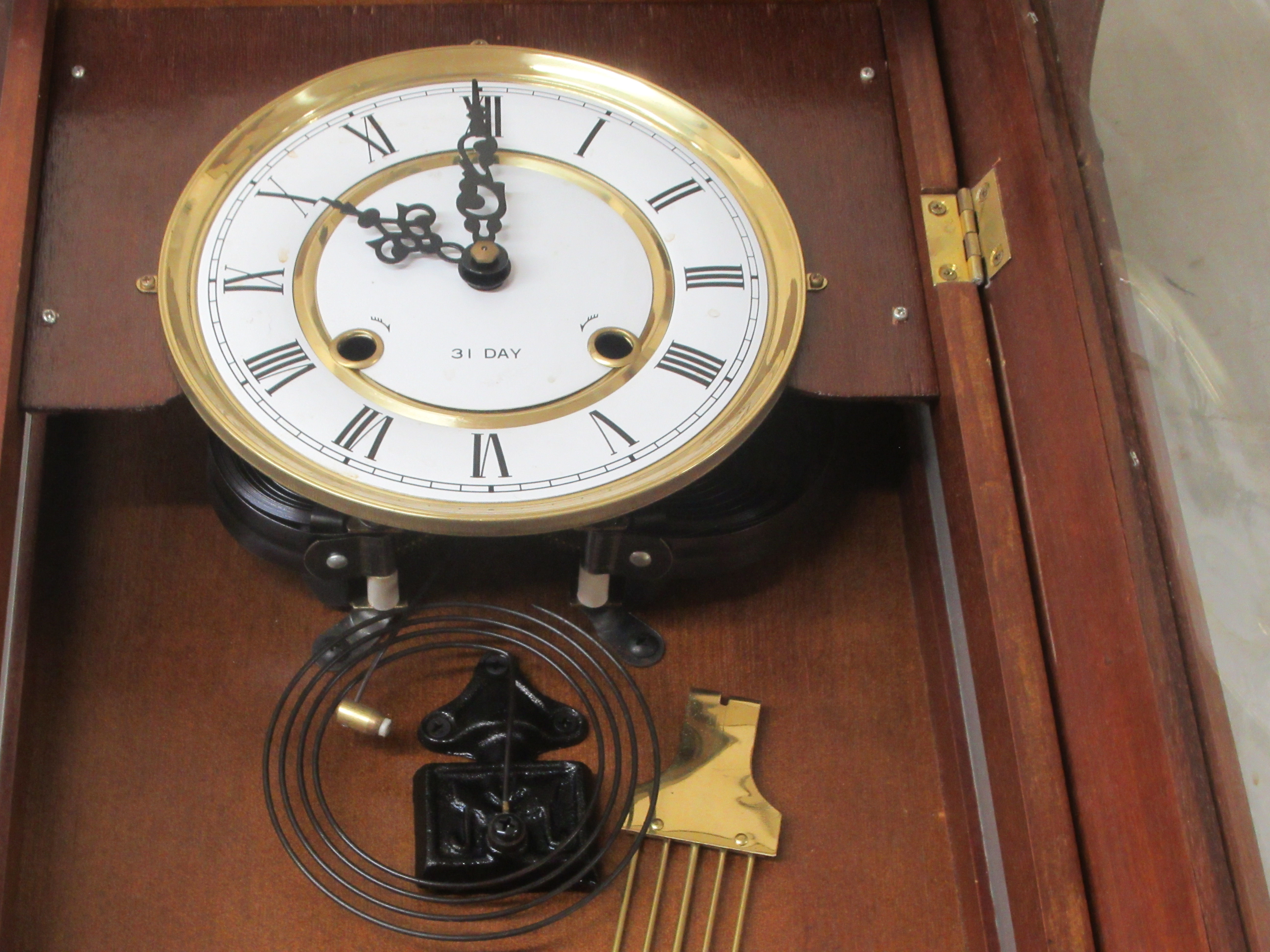 A modern mahogany cased and glazed wall clock; the 31 day movement faced by a Roman dial  43"h - Image 3 of 4