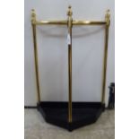 A late Victorian style brass and cast iron demi-lune stickstand  22"h