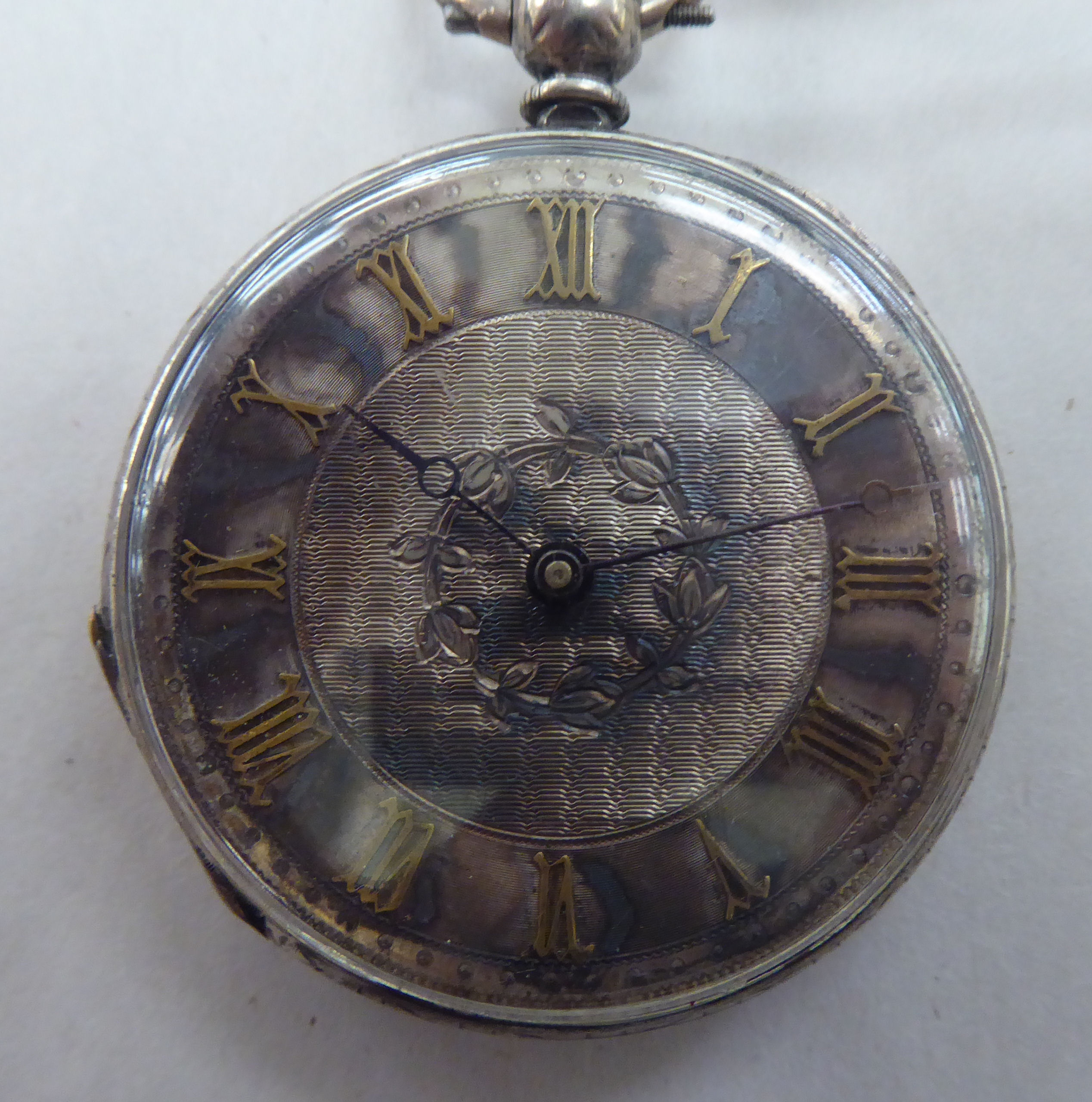 A silver cased pocket watch, faced with a Roman dial