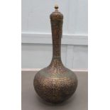 A 20thC Middle Eastern enamelled and brass vase with a tall neck and bulbous body, on a pedestal