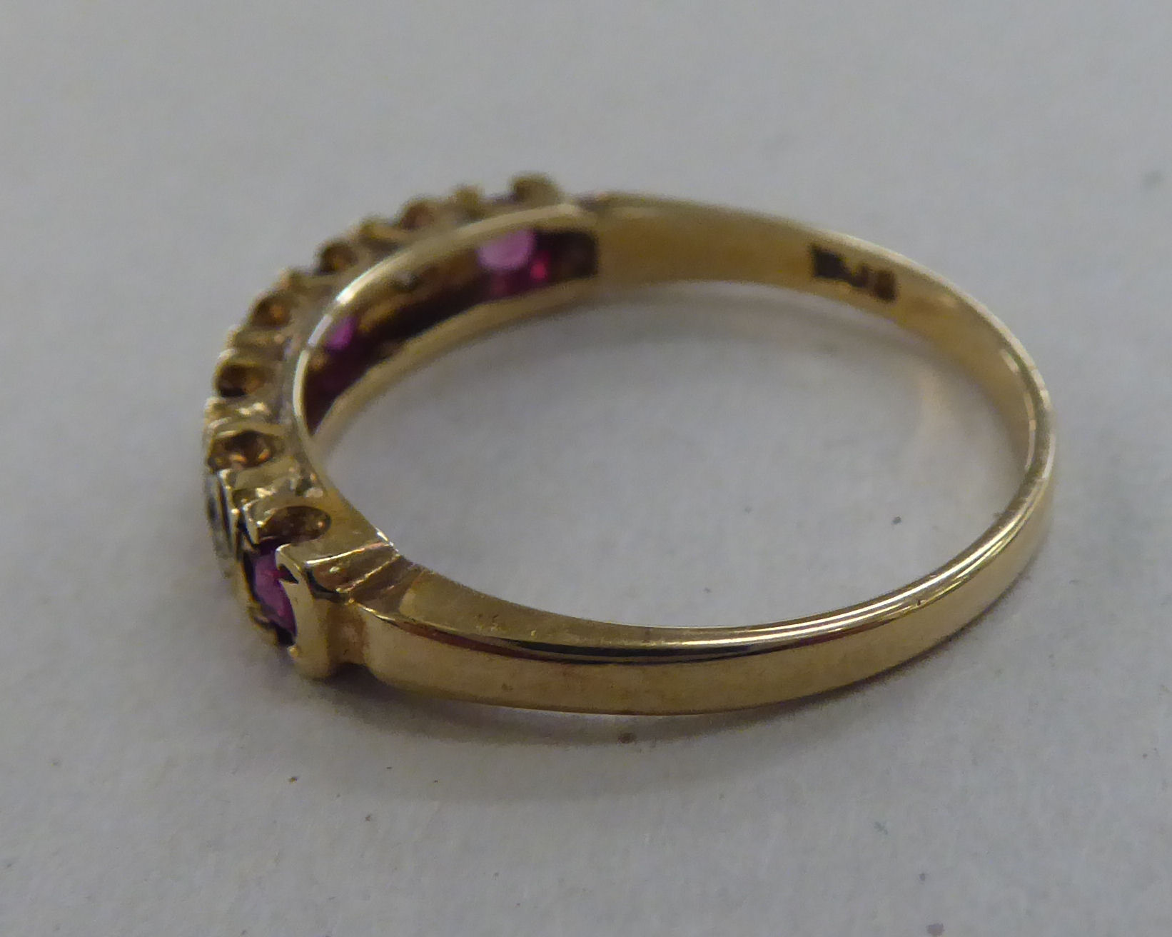 A 9ct gold eternity ring, set with alternating rubies and diamonds - Image 2 of 5