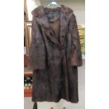 A full length brown mink coat