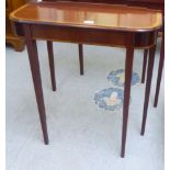 A Bright's of Nettlebed mahogany console table, raised on square, tapered legs  28"h  31"w