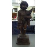 A vintage carved wooden papier mache mould, fashioned as a standing cherub  18"h