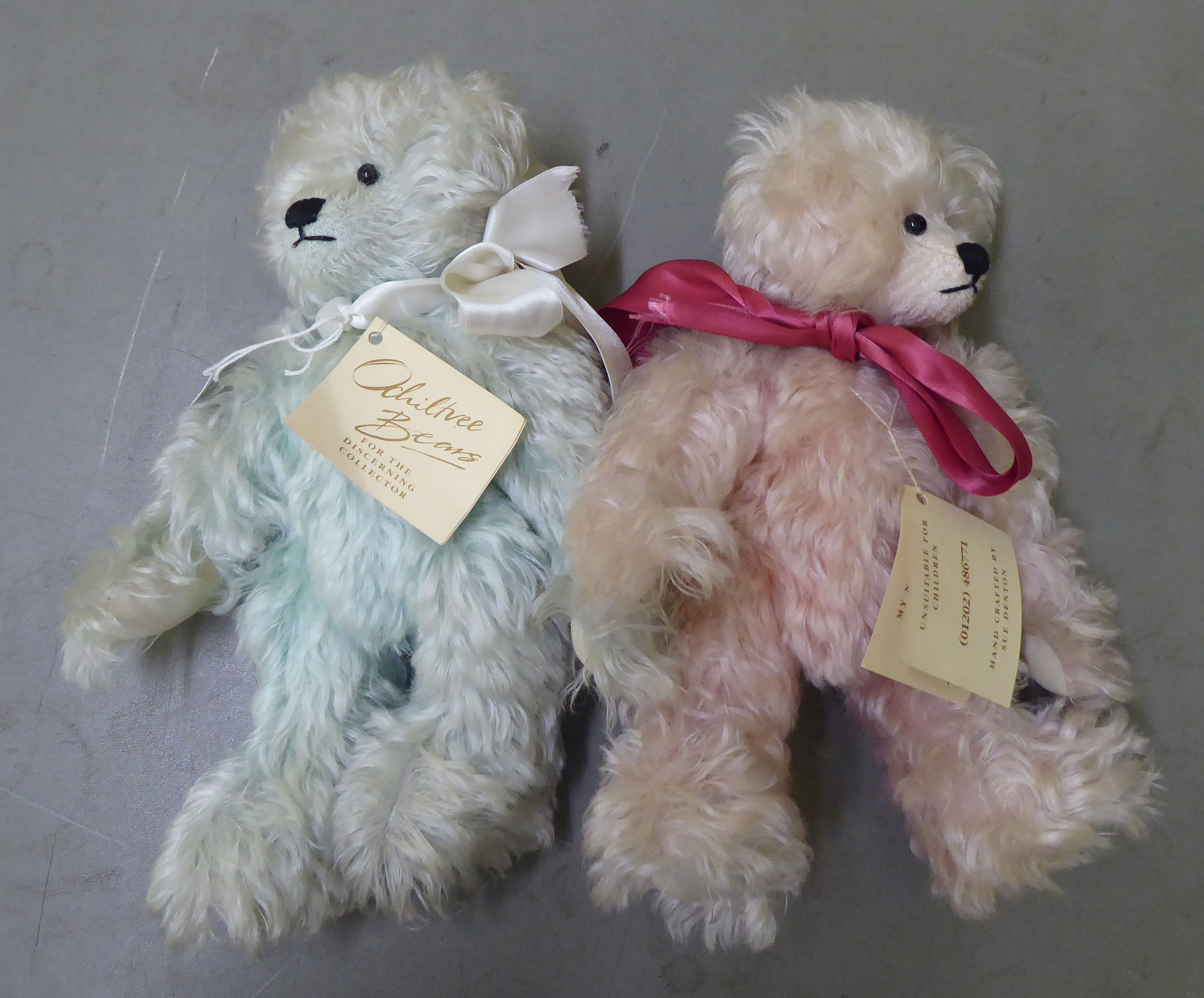 Two Ochiltree Teddy bears, in pale blue  12"h the other soft pink  12"h