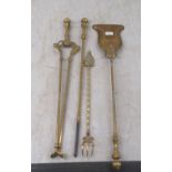 A set of three brass fire irons  comprising a shovel, poker and tongs