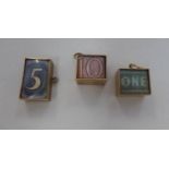 Three 9ct gold cased banknotes, on pendant rings