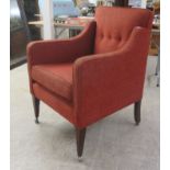 An Edwardian iron red fabric upholstered chair, raised on square, tapered legs