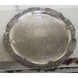 A Reed & Barton silver plated serving tray with elaborately engraved and cast decoration  19.5"dia