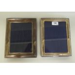 Two silver photograph frames, on easel backs  8.5" x 7"  mixed marks