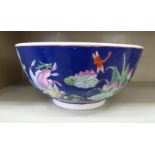 A 20thC Chinese porcelain bowl, decorated with birds and fish  12"dia