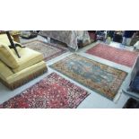 Four various rugs: to include a Turkoman on a red ground  49" x 80"