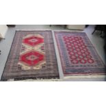 Two dissimilar Persian design rugs on multi-coloured grounds  each 50" x 72"