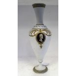 A late 19thC opaque white glass vase of ovoid pedestal form, having a narrow neck and flared rim,