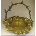 A late Victorian cast brass centrepiece basket with a crimped wavy edge, engraved leaf, berry and
