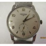 A vintage Longines stainless steel cased bracelet wristwatch, faced by a gilded Arabic and baton