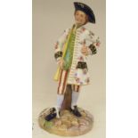 A Royal Worcester china figure, a standing young man wearing a tricorn hat, frockcoat and