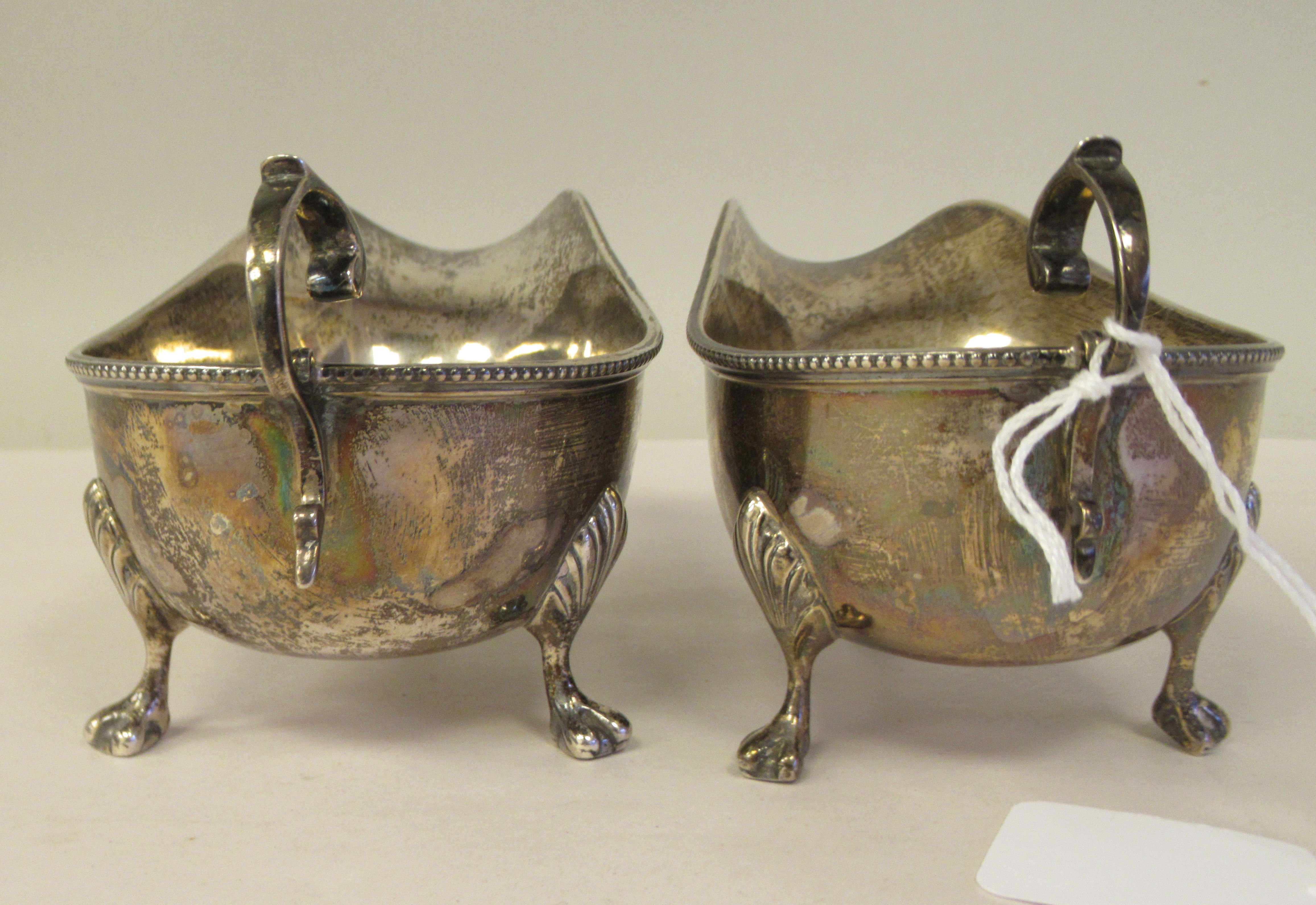 A pair of silver sauce boats with bead borders and C-scrolled handles, elevated on cast paw feet - Image 4 of 7