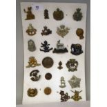 Twenty-four military regimental cap badges and other insignia, some copies: to include British