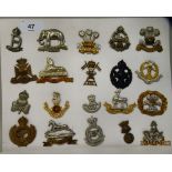 Twenty military regimental cap badges and other insignia, some copies: to include Middlesex
