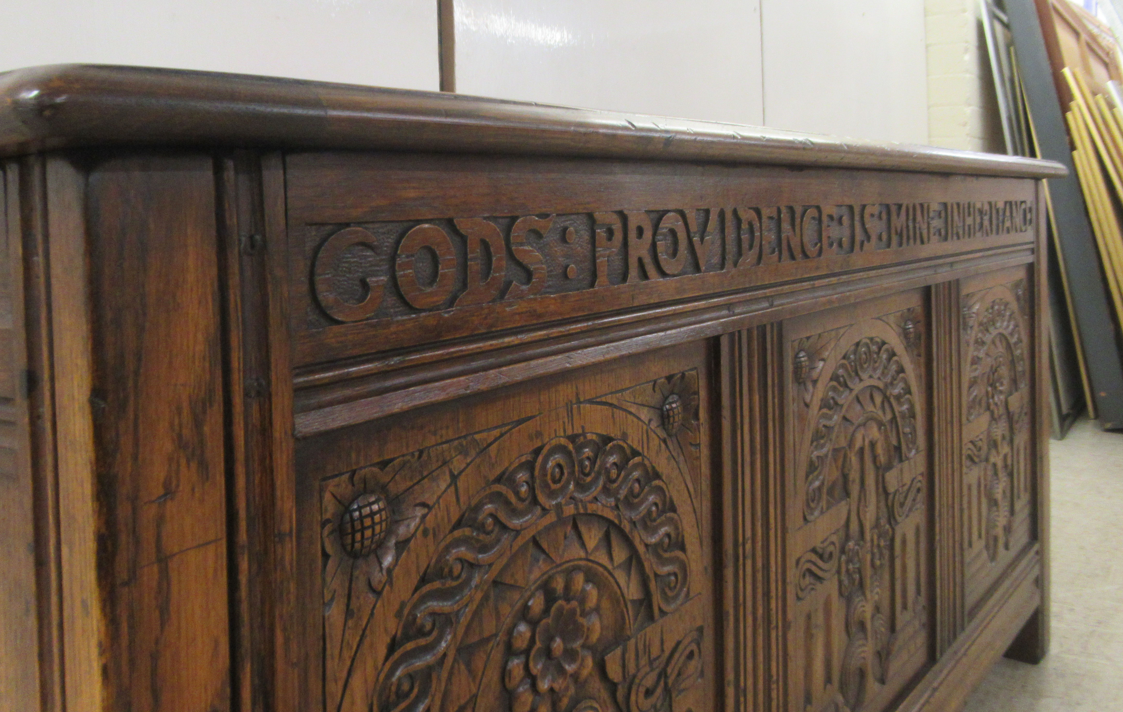 A Brights of Nettlebed period style, tri-panelled oak chest, the front with relief carved - Image 5 of 7