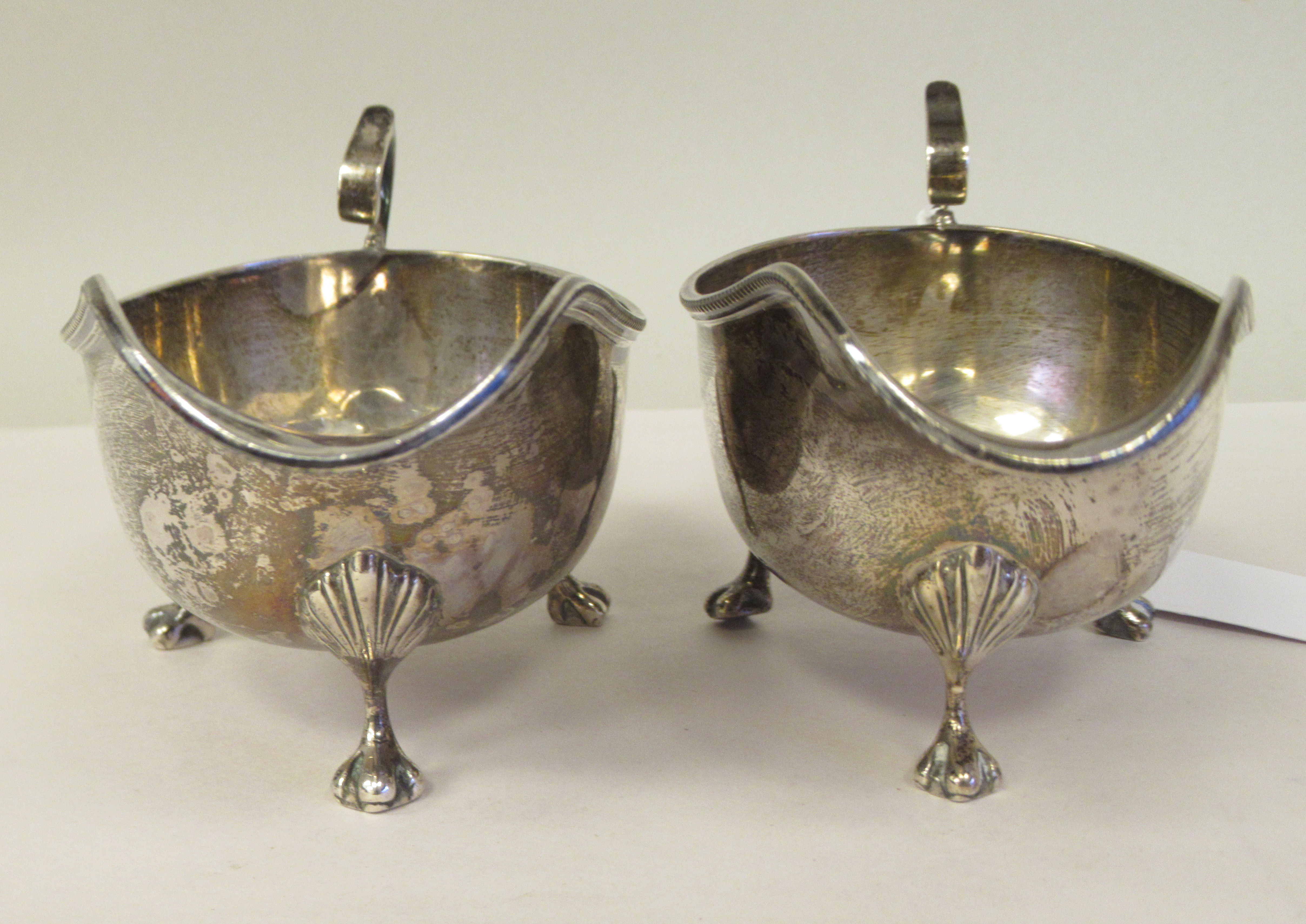 A pair of silver sauce boats with bead borders and C-scrolled handles, elevated on cast paw feet - Image 2 of 7