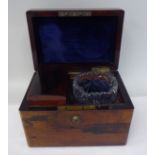 A late 19thC rosewood tea casket with straight sides and a hinged lid, on a Bramah lock, enclosing a