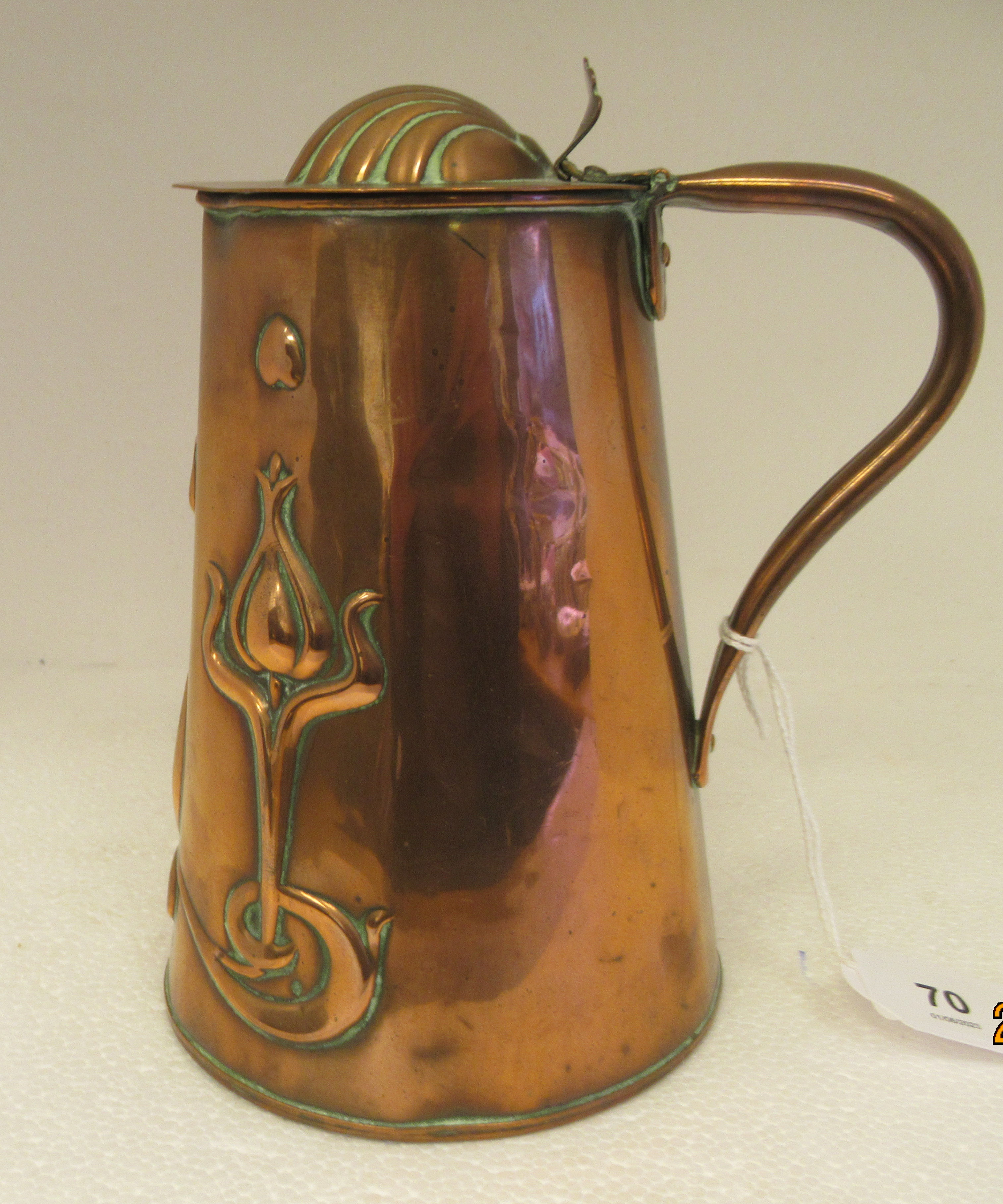 An early 20thC JS&S copper milk jug of tapered, cylindrical form, having a hollow loop handle and