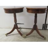 A pair of Brights of Nettlebed mahogany and walnut finished lamp tables, each with a frieze