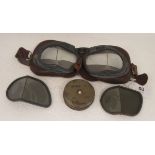 A pair of World War II MkVIII flying goggles, bears an indistinctly printed circular mark to the