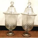 A pair of 19thC design, clear cut glass pedestal vases of inverted bell design with covers and