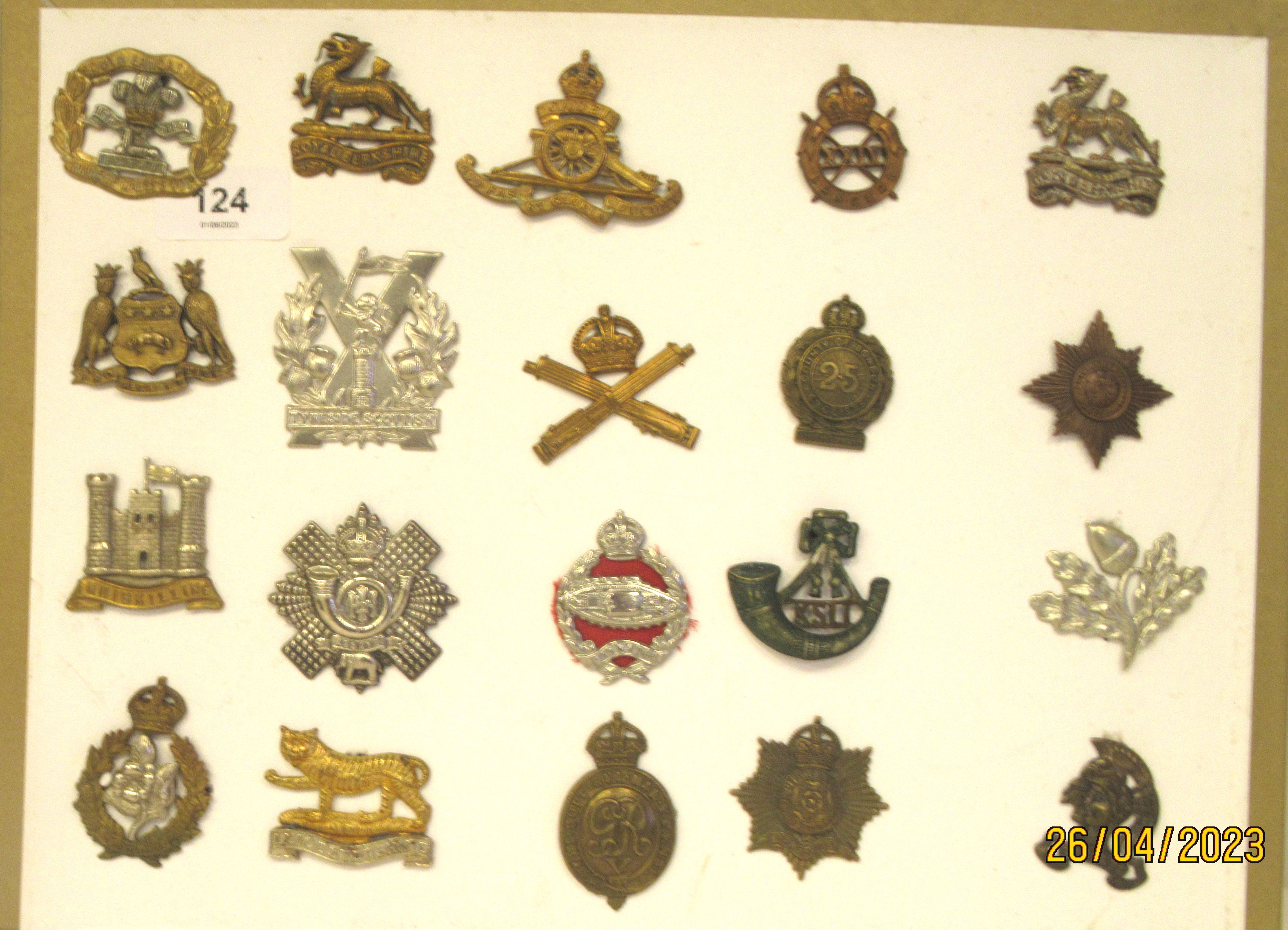 Twenty military regimental cap badges and other insignia, some copies: to include Tyneside Scottish,