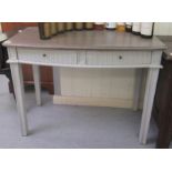 A modern shabby chic painted bow front two drawer hall table, raised on square, tapered legs  30"