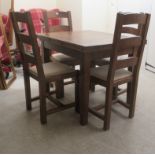 A modern French country style stained oak dining table, the panelled and dowelled foldover top