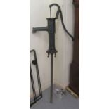 A Victorian style black painted water pump head with an angled spout and operating handle  25"h (