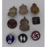 Three ARP silver badges; a Nazi Party and American Friendship badge; an Adolph Hitler 1939