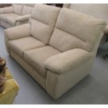 A modern two person settee, upholstered in textured effect biscuit coloured fabric  60"w
