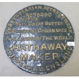 A cast and painted butter churn sign, from Hatherway of Chippenham  15"dia