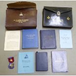 Masonic regalia: to include two hide wallets; aprons; and a silver and enamel medal