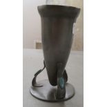 An Art Nouveau Maple & Co Ltd of London pewter and turquoise enamel vase of tapered form, elevated