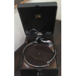 A mid 20thC His Master's Voice table-top, portable gramophone, in a black fabric finished case