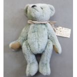A 1977 Ollies Teddie's 'Elizabeth' bear, in pale blue plush with mobile limbs  13"h